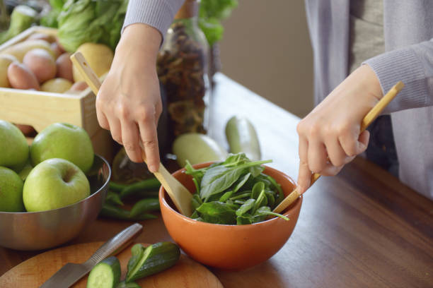 istock woman cooking in the kitchen 959717134