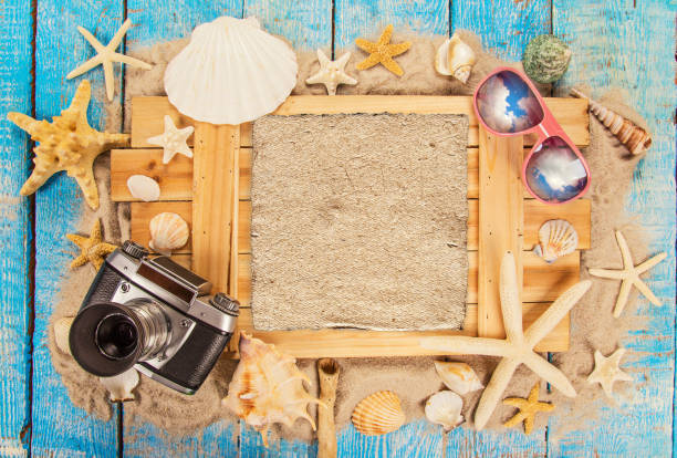 istock Summer traveling time. Sea holiday background with various shells 959718094