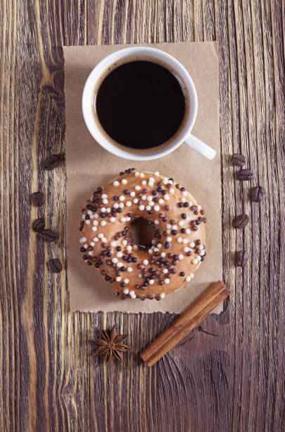 istock Coffee and donut with chocolate balls 959728842
