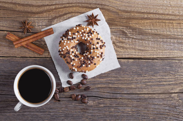istock Coffee and donut with chocolate balls 959728908