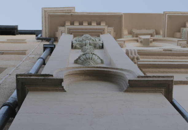 istock Looking up the side of a building with a statue 959729498