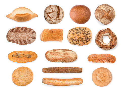 Large bread, baguettes and cake collection. Top view isolated on white, clipping path included