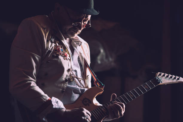 istock Senior Rock Musician Playing Electric Guitar 959731702