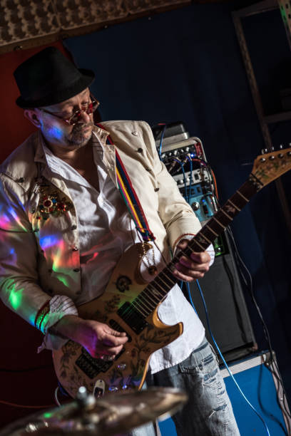 istock Senior Rock Musician Playing Electric Guitar 959731706