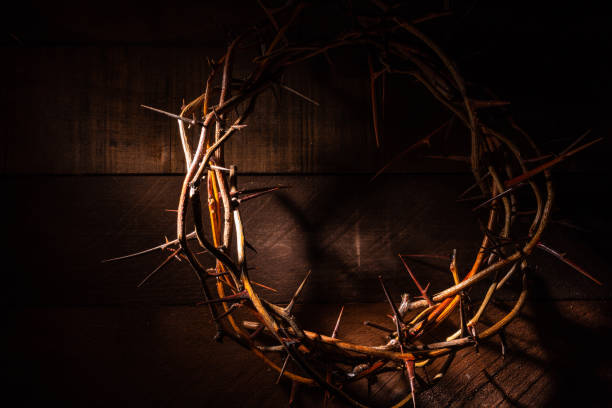 istock A crown of thorns on a wooden background. Easter Theme 959732540