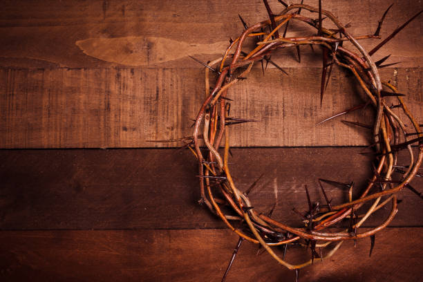 istock A crown of thorns on a wooden background. Easter Theme 959736436