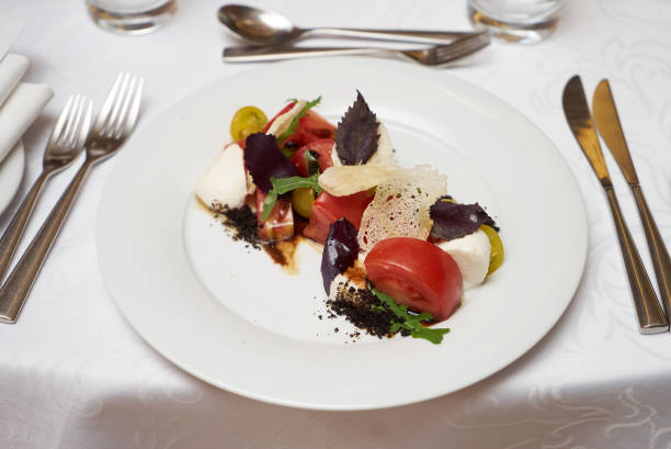 istock Vegetarian food with marinated tomatoes, arugula, mozzarella che 959737228