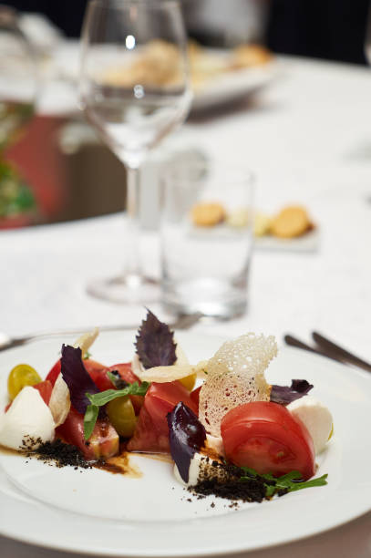 istock Vegetarian food with marinated tomatoes, arugula, mozzarella che 959739752