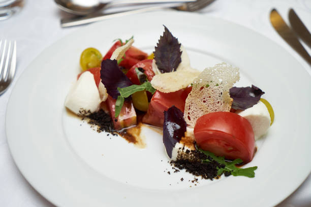 istock Vegetarian food with marinated tomatoes, arugula, mozzarella che 959739950