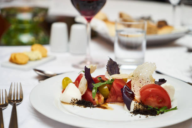 istock Vegetarian food with marinated tomatoes, arugula, mozzarella che 959740726