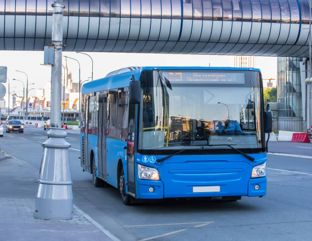 istock bus goes along street 959740874