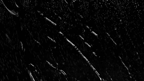 istock Raindrops of White Water on Glass 959748692