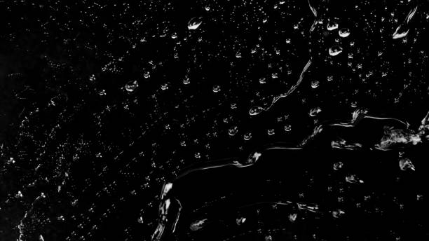 istock Raindrops of White Water on Glass 959749158