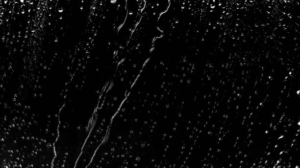istock Raindrops of White Water on Glass 959749162