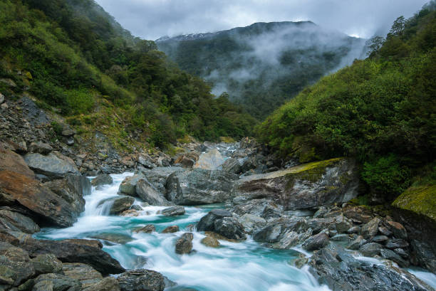 istock Fast flowing river with Fog 959749178