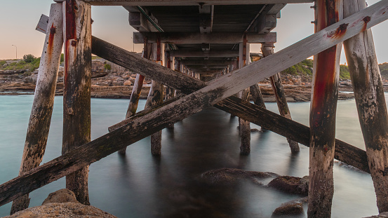 Walkway to Bare Island, Sydney, Australia. View from underneath this historic timber bridge.