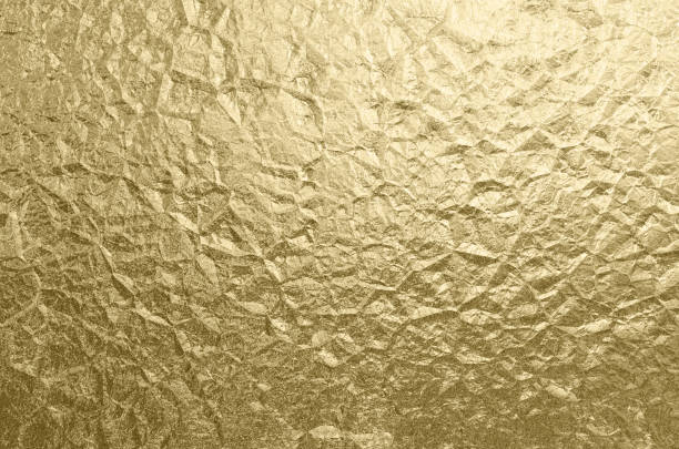 金箔しわテクスチャ休日背景抽象的な黄金パターン - wrapping paper foil gold paper ストックフォトと画像