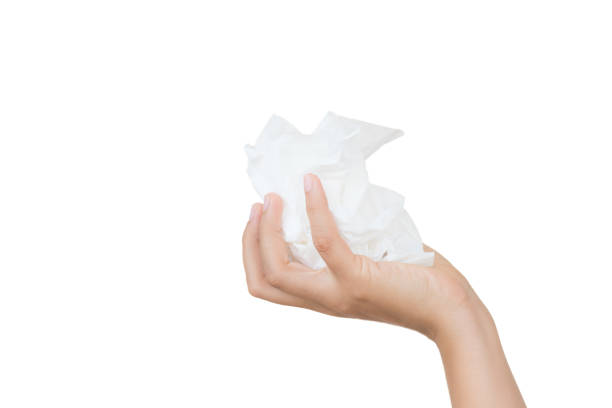 istock Woman hand holding or picking white tissue paper. 959768998