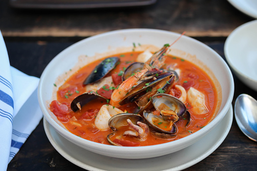 A bowl of rustic seafood stew