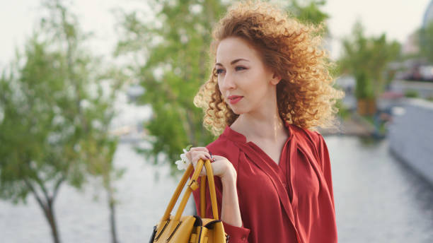 istock Girl with curly hair. Springtime 959779430