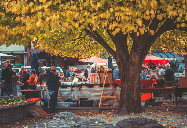 Queenstown, New Zealand, 27 April 2018: tourism on the local market. Creative Queenstown Arts and Crafts Markets which is located at the lake front at Earnslaw Park in Queenstown. There are selling wide variety of goods