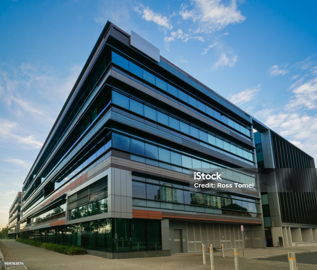 Commercial Offices in the city View of office buildings during the evening in the city Office Building Exterior Stock Photo