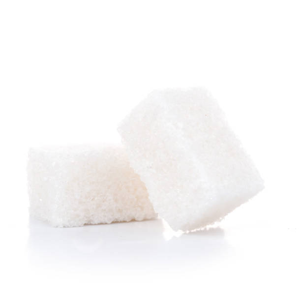istock Two tasty sugar cubes isolated on the white background 959787220