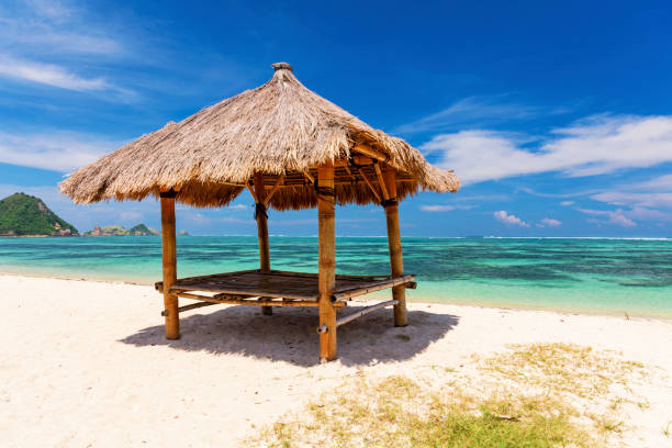 istock Balinese hut on the white sandy Kuta Beach, Lombok 959791378