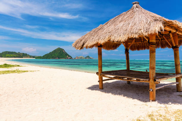 istock Balinese hut on the white sandy Kuta Beach, Lombok 959791428