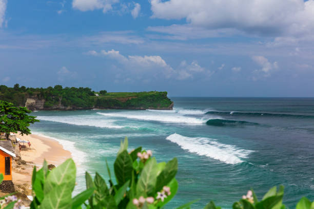 Big waves rolling onto the white sandy Balangan Beach, Bali, Indoneasia