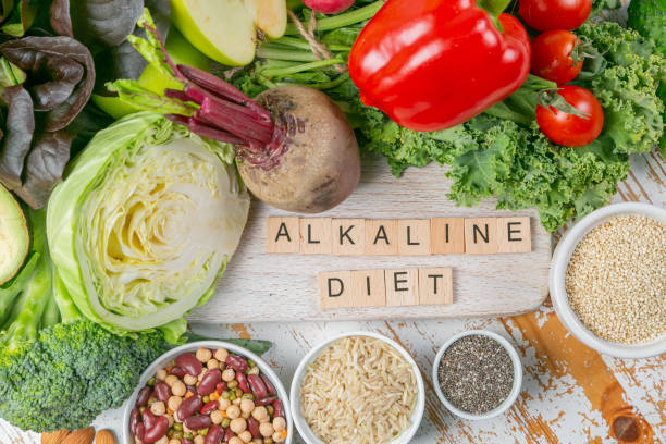 Alkaline diet concept - fresh foods on rustic background Alkaline diet concept - fresh foods on rustic background, copy space alkaline stock pictures, royalty-free photos & images