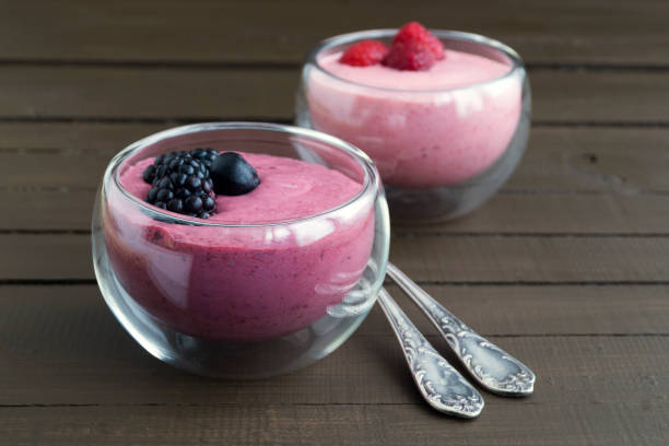 istock Blueberry yogurt with fresh berries on a wooden table. 959797218