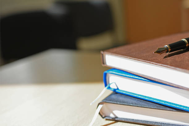 istock Notebook on the desktop cover, pen, business, copy space 959798432