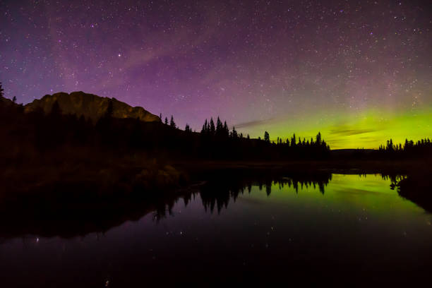 istock Aurora borealis (Northern lights) reflect in mountain lake 959808404