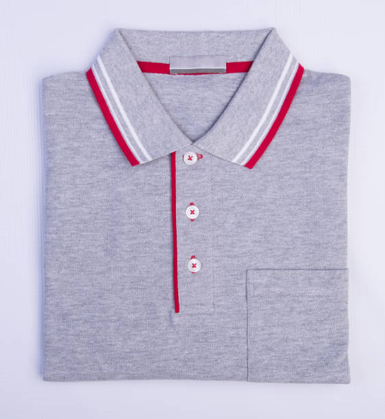 istock shirt or mens folded polo shirt on background 959808512