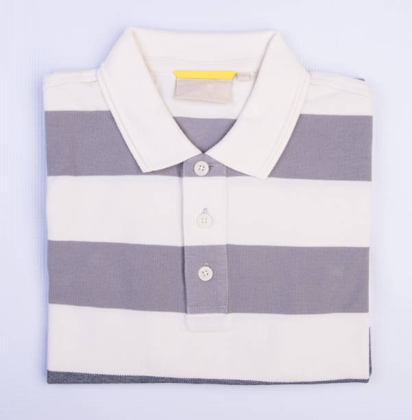 istock shirt or mens folded polo shirt on background 959808548
