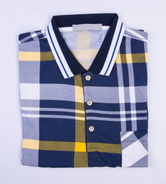 istock shirt or mens folded polo shirt on background 959808742