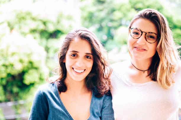 istock Two young female friends looking at the camera 959809450