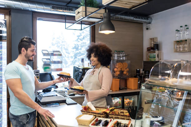 istock Young man in fast food restaurant buying 959811236
