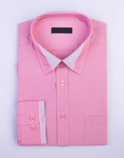 istock shirt or mens folded polo shirt on background 959811716
