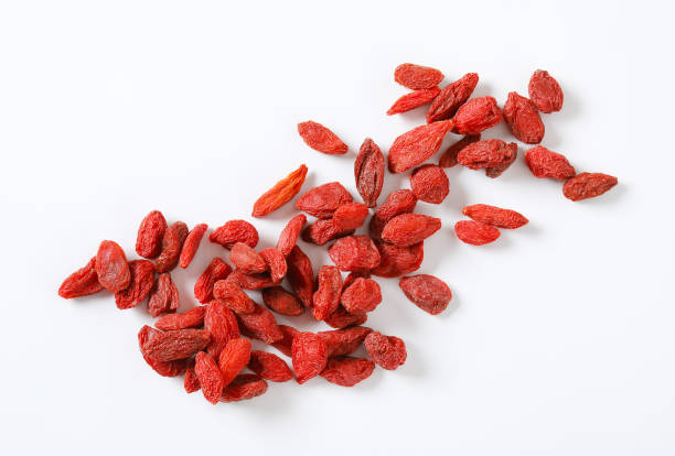 handful of goji berries handful of goji berries on white background healthy eating red above studio shot stock pictures, royalty-free photos & images