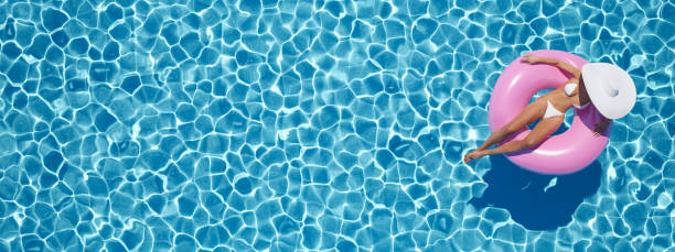istock woman swimming on float in a pool. 3d rendering 959823176