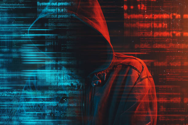 istock Stereotypical image of computer hacker with hoodie 959826922