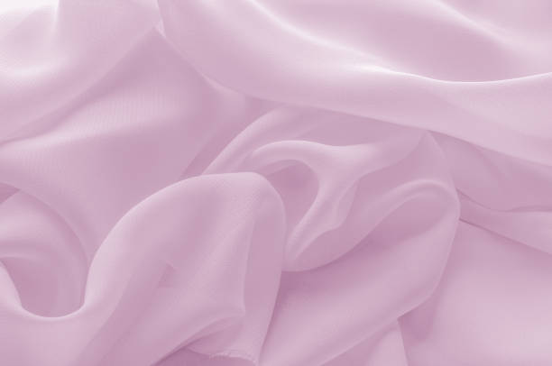 istock Texture, background, pattern. Silk fabric pale pink, abstract folds 959827966