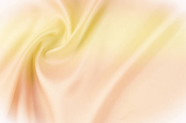 istock Texture background of fabric. Beige fabric. Silk fabric wallpaper texture background pattern in sepia pastel yellow cream beige tint: Lovely natural silk textured textile 959828158