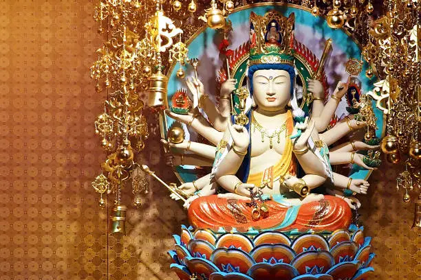Chines Goddess Guan Yin in Thousand Hand figure at chinese public temple in Singapore