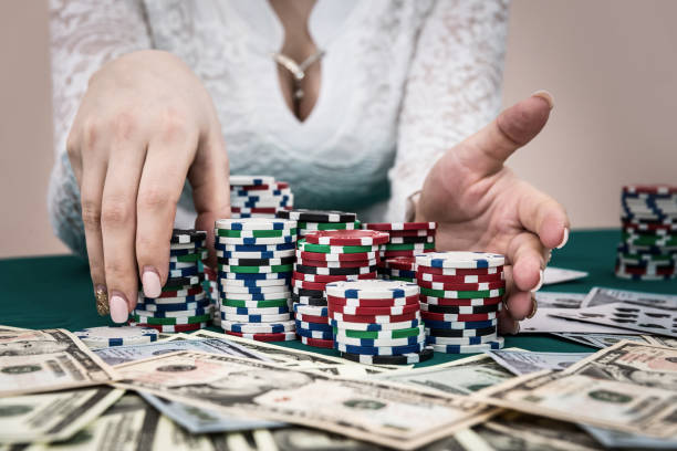 Pile of chips in female hands ready to make bet Pile of chips in female hands ready to make bet child gambling chip gambling poker stock pictures, royalty-free photos & images