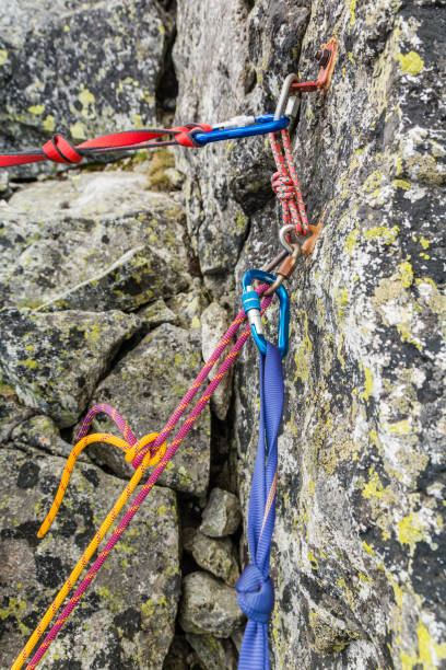 istock Rappel stance - safety loop and rappel rope while preparing for rappelling from the rappel anchor after finishing climbing in the mountains. 959841598