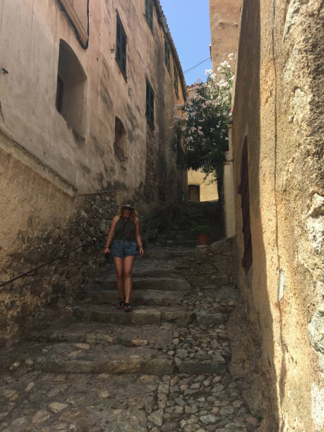 istock Young Woman Exploring Small Town on Summer Vacations 959841906