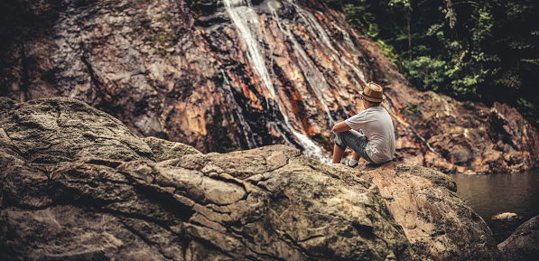 Young tourist exploring jungle